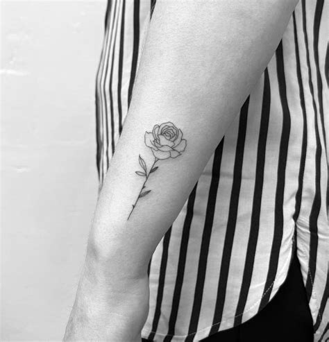 Fine Line Rose Tattoo Located On The Wrist