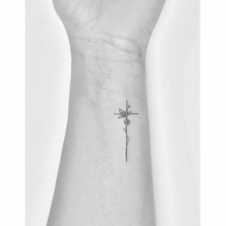 Fine Line Style Flower Cross Tattoo Located On The