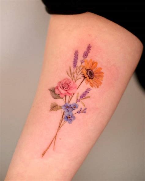 Micro Realistic Flower Bouquet Tattoo Located On The Micro Realistic Flower Bouquet Tattoo Located On The