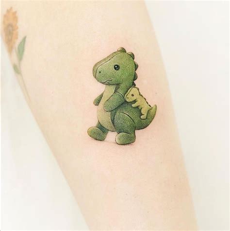 Pin By Elizabeth On Tatus Dinosaur Tattoos Cute Tiny Tattoos Disney