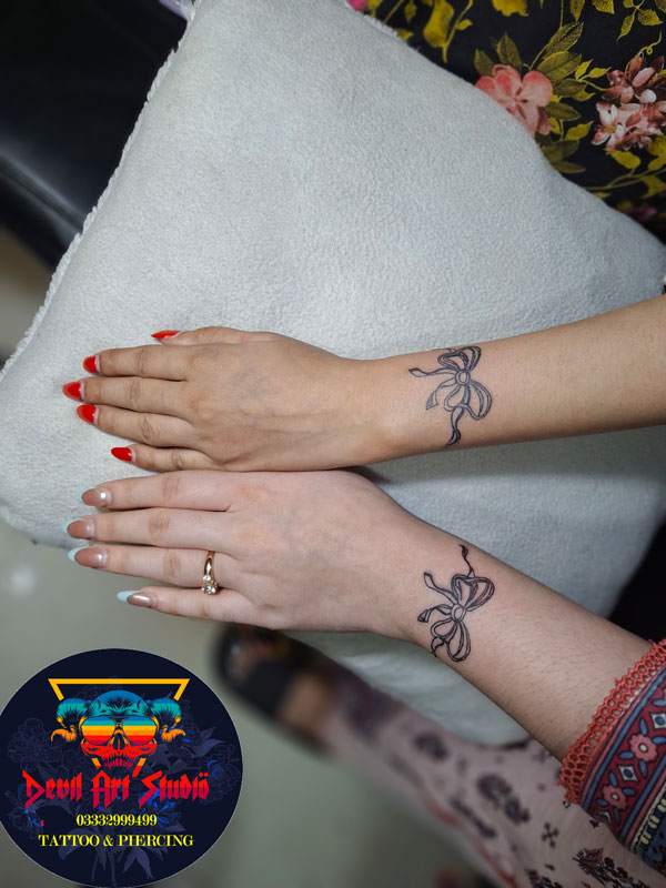 Two Sisters From Lahore Get Matching Bow Tattoos Permanent Tattoo Two Sisters From Lahore Get Matching Bow Tattoos Permanent Tattoo